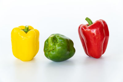 Close-up of bell peppers against white background