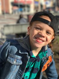 Portrait of happy boy standing outdoors