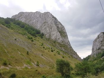 Low angle view of rocks against sky