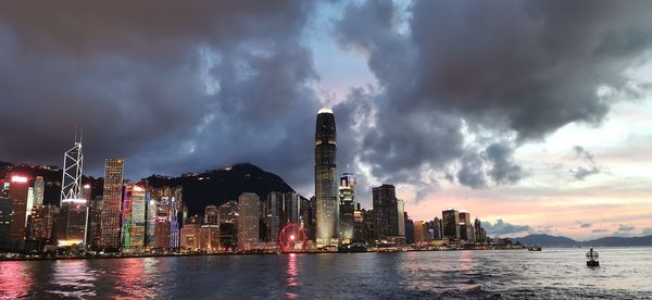 Panoramic view of sea and buildings against sky