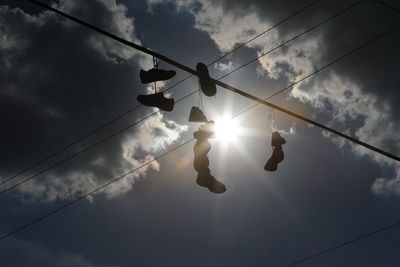 Shoes hanging on powerline