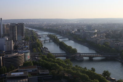 High angle view of bridge over river amidst buildings in city