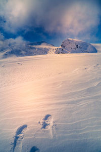 Scenic view of snowcapped mountains against sky