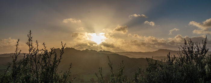 Panoramic view of landscape against sky during sunset
