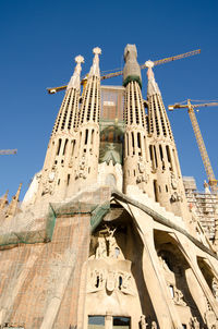 Low angle view of statue against building