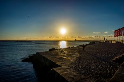 Scenic view of sea at sunset