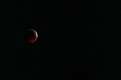 Low angle view of moon against sky at night