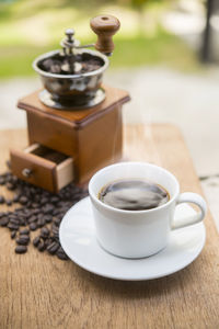 Close-up of coffee cup on table