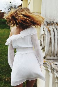 Rear view of woman standing in park