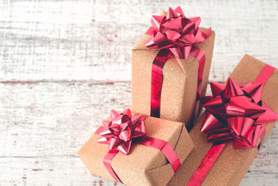 High angle view of christmas presents on wooden table