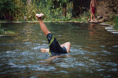 Man surfing in lake