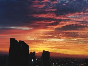 Silhouette of city at sunset