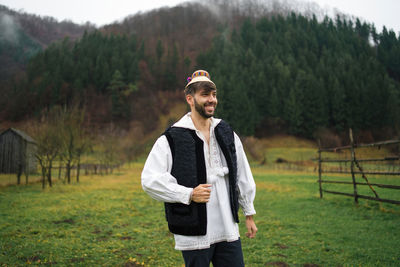 Young man standing on field