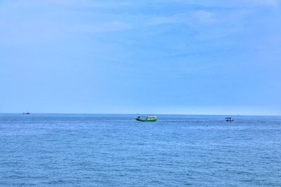 Sailboat in sea against sky