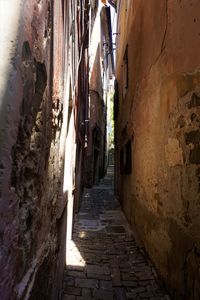 Narrow alley amidst buildings