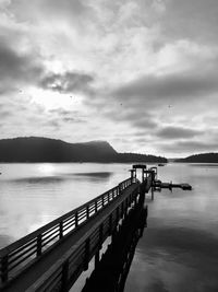 Pier over sea against sky