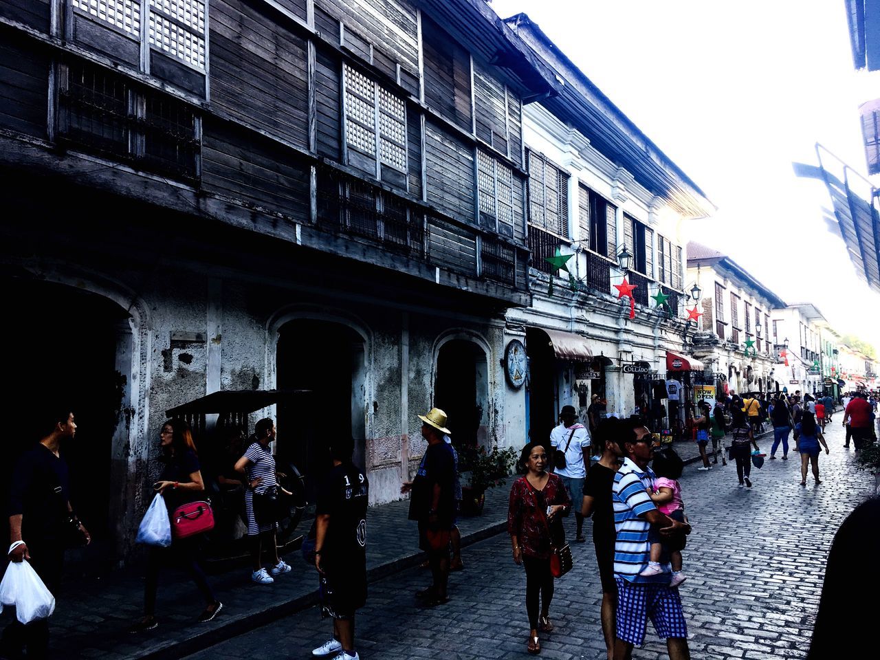 CROWD IN FRONT OF BUILDINGS