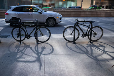 Bicycle parked on road in city