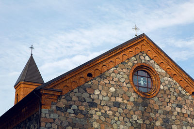 Roof of the old catholic church made of stone in braslav