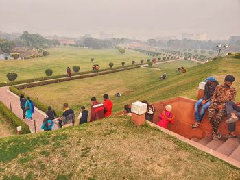 People on field against sky