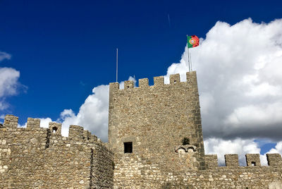 Low angle view of castelo dos mouros against blue sky