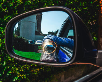 Reflection of car on side-view mirror