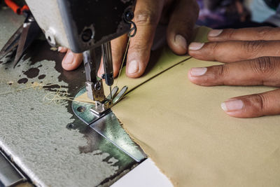 Cropped hands sewing machine