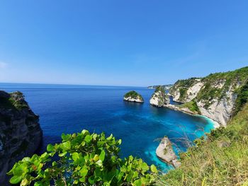 Scenic view of sea against clear blue sky