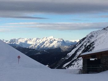 Scenic view of snow covered mountains