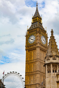 Low angle view of clock tower against sky