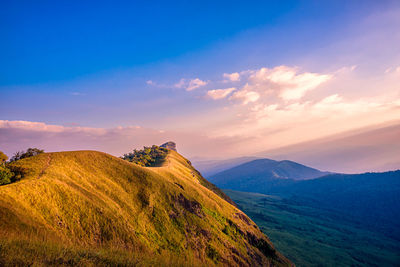 Scenic view of mountains against sky during sunset