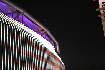 Low angle view of illuminated modern building