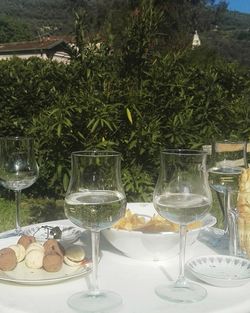 Close-up of wine glasses on table