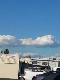 Cars on road against sky
