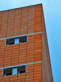 Low angle view of building against blue sky