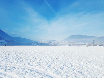 Scenic view of snow covered mountains against sky