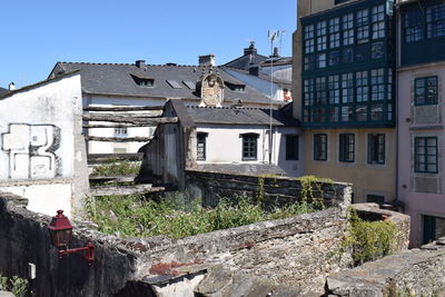 Low angle view of abandoned buildings against sky