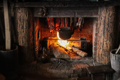 View of smoked meat on a brick fire place