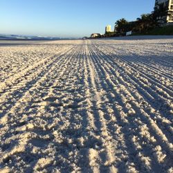 Scenic view of beach against clear sky