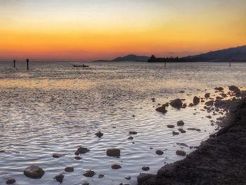 Scenic view of sea at sunset