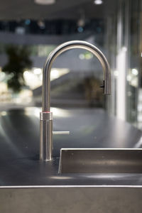 Close-up of faucet in bathroom