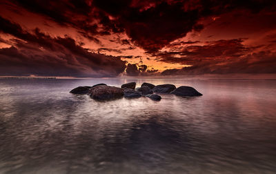 Scenic view of sea against sky during sunset