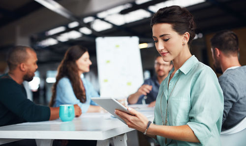 Businesswoman using tablet pc in office