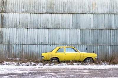 Yellow car on snow