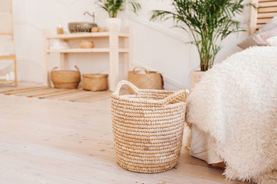 Close-up of wicker basket on table at home