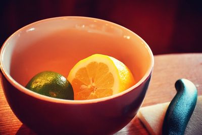 Close-up of orange juice in bowl on table