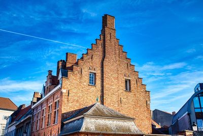 Low angle view of building against blue sky