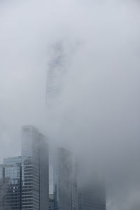 Modern buildings in city against sky