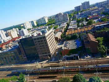 High angle view of cityscape against clear blue sky