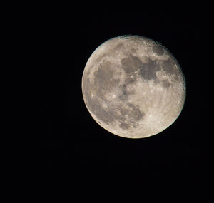 Low angle view of moon against clear sky at night